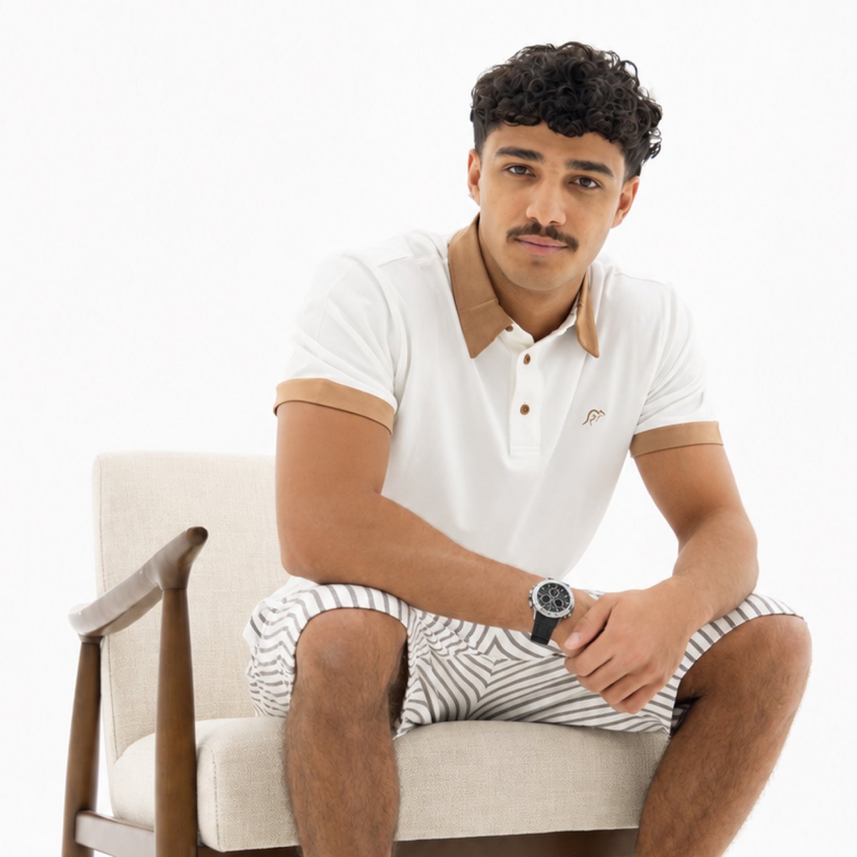 Man in a white Melon polo